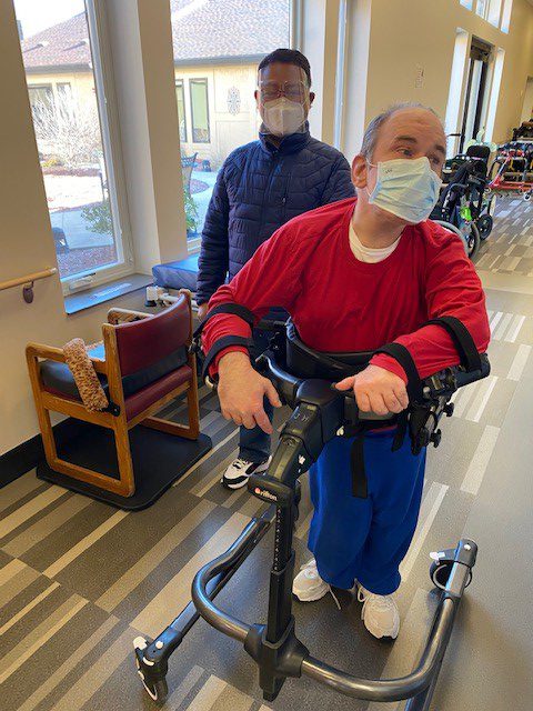 Verland resident and assistant doing restorative care