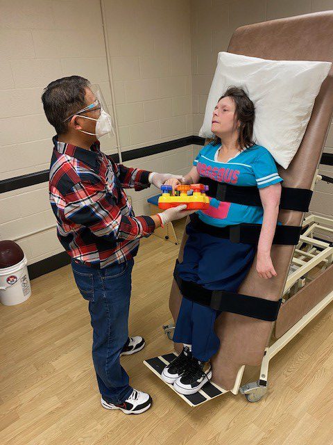 Verland resident and assistant doing restorative care