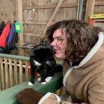 Woman kissing a cat